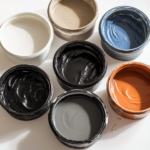 Top view of containers with colored slips inside sitting on a white table